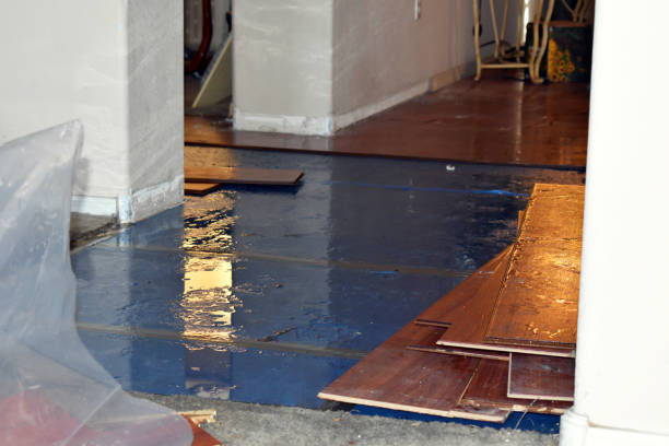 Professional Flood Damage Restoration technician working in North Smithfield, RI